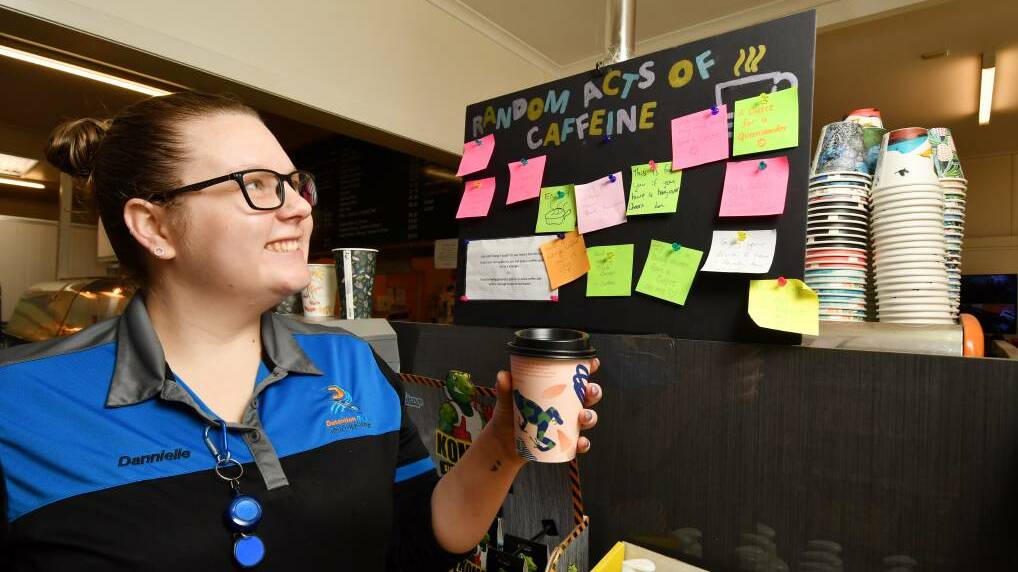 CUP OF KINDNESS: Store manager Dannielle Hite-Jacques is proud of the Random Acts of Caffeine board, designed to lift the community's spirits. Picture: Brodie Weeding