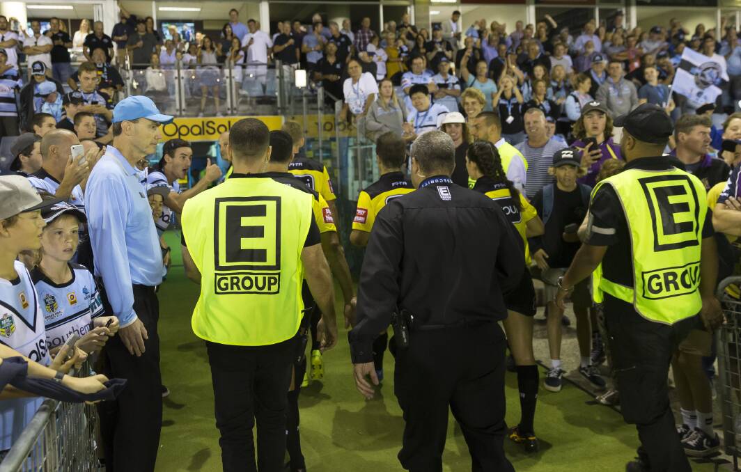 Whistlemania: Referees were escorted from the pitch at half time break between the penalty-heavy Sharks and Storm clash at Southern Cross Group Stadium on Friday night. Picture: AAP