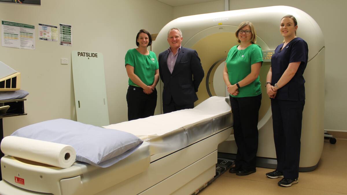NSW state manager, Matt Ayers, being shown the new CT scanner.