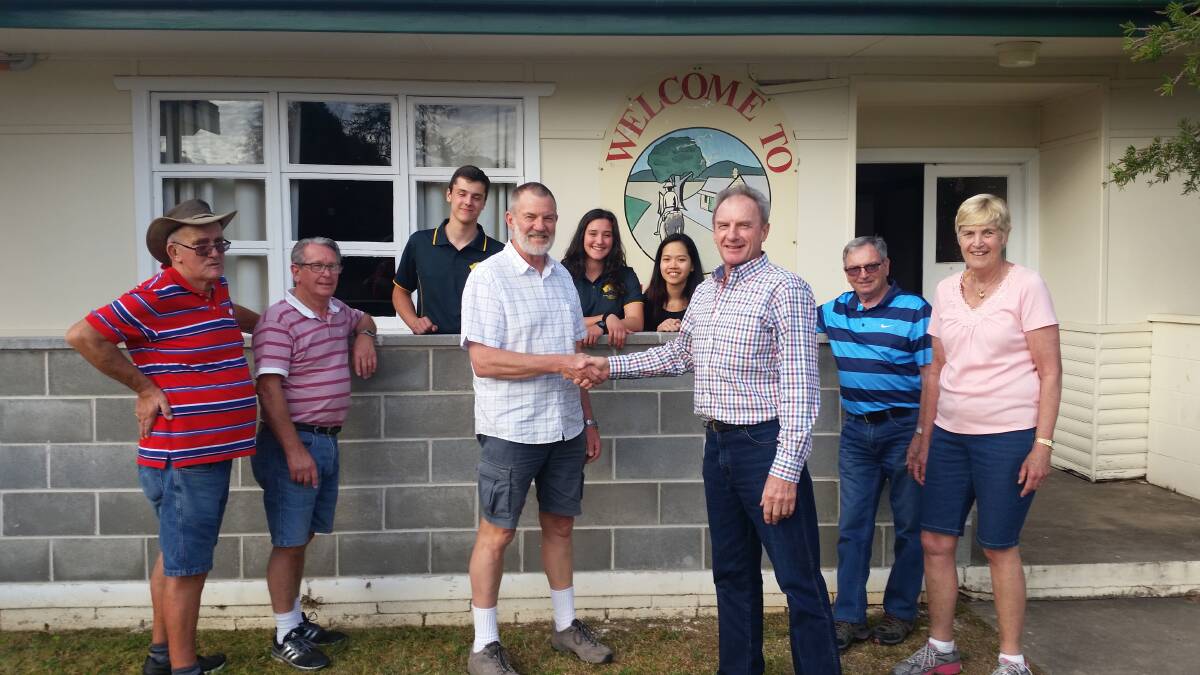 Garry Connelly (right) welcomes Dennis Clark and his team of volunteers at the Cassilis Community Hall.