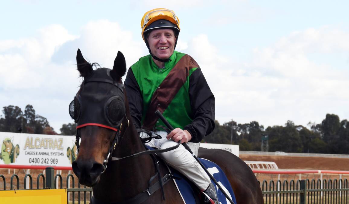 WINNING FORM CONTINUES: Dubbo jockey Ken Dunbar (pictured after a recent win at Dubbo Turf Club) secured a four-win haul at Grenfell on Saturday. Photo: NICK GUTHRIE