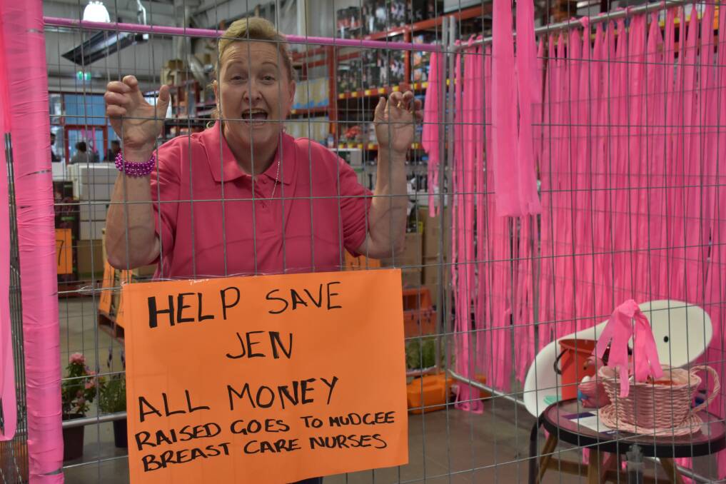 All for a good cause: Bunnings employee Jen Roth was locked in cage to help raise money for Mudgee Breast Care Nurses. Photo: File.