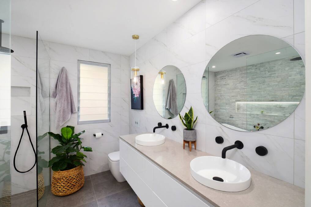 Stunning style: Black tapware and natural stone can create a gorgeous look for your bathroom. Photo: Shutterstock.