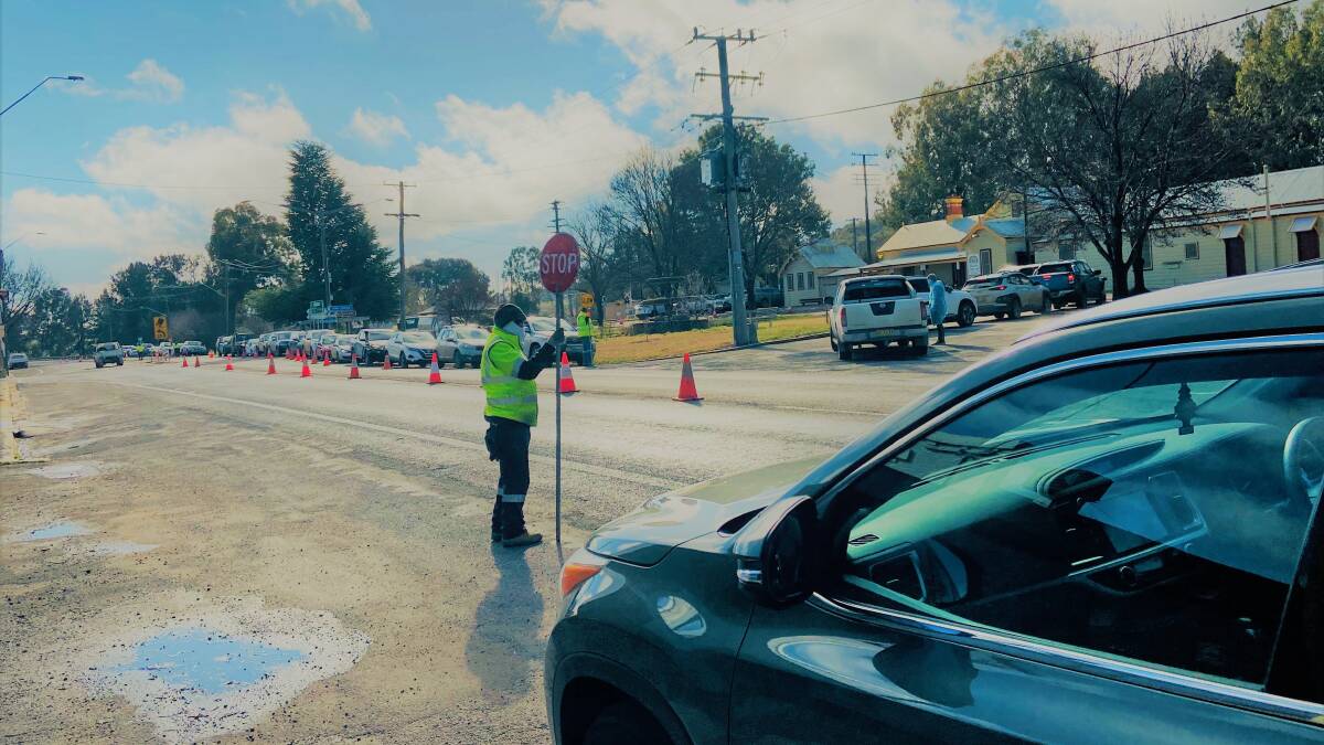 VIGILANCE: The line for COVID testing in Molong. The community is being urged to get tested after fragments were found in the town's sewage. PHOTO: SUPPLIED
