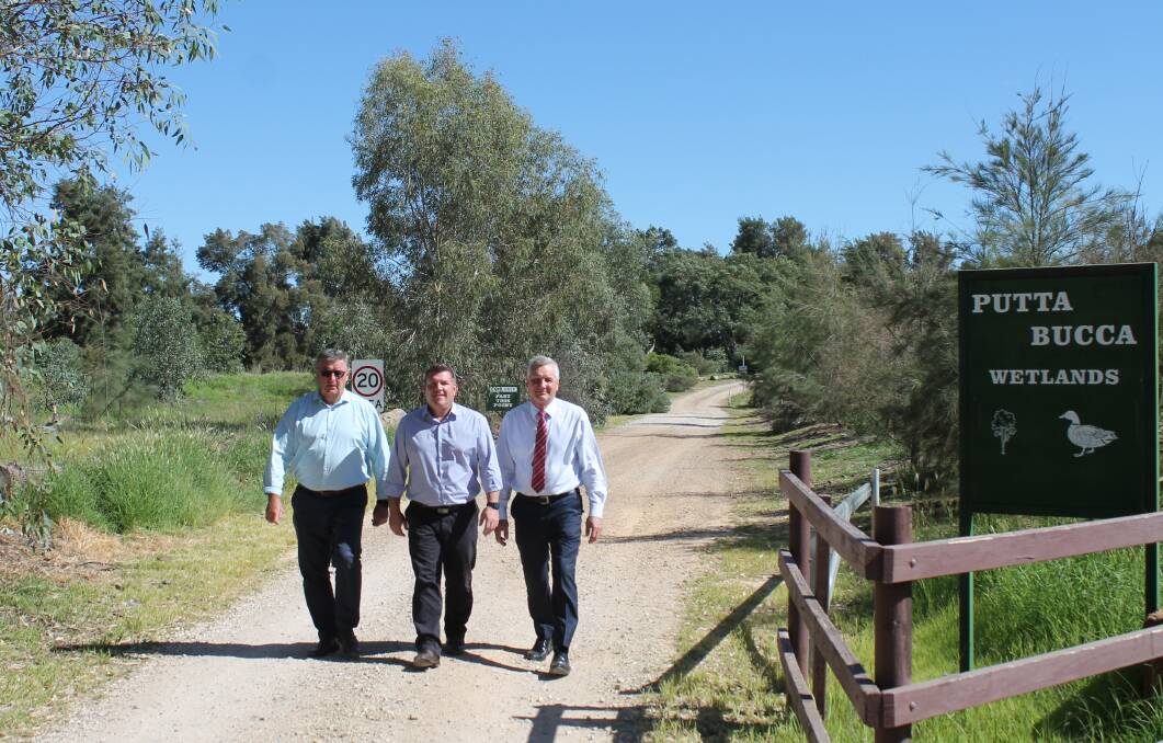 Mayor Des Kennedy, Dugald Saunders MP and MWRC general manager Brad Cam at the Putta Bucca Wetlands entry that will be linked to the path.