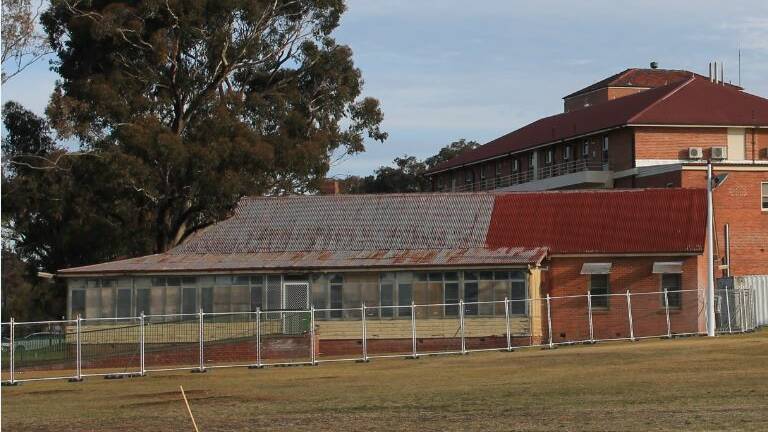 ISOLATED: This building - pictured ready for demolition late last year - went through several uses, including as a training school for nurses. 