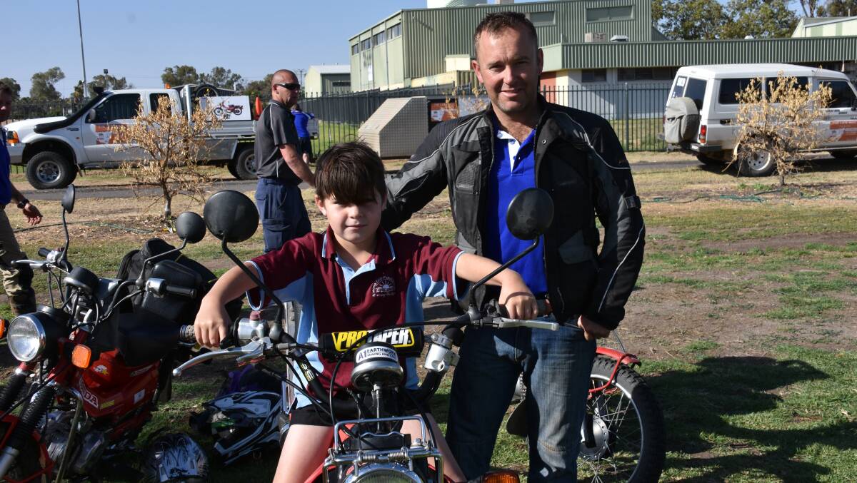 Cooper Picker tries out Chris Pilley's bike, when the Late Mail had breakfast in Moree.