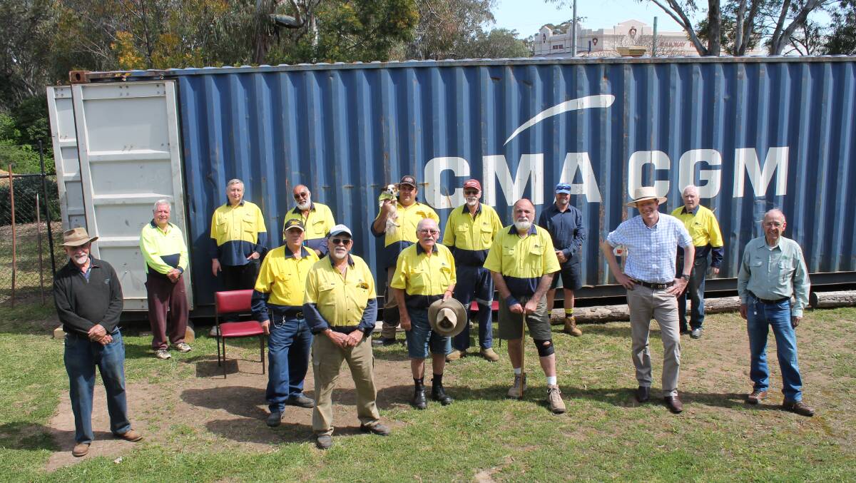 Members of the Kandos Rylstone Men's Shed and Andrew Gee MP, with the shipping container which will be used to extend the facility and provide an indoor seating area.