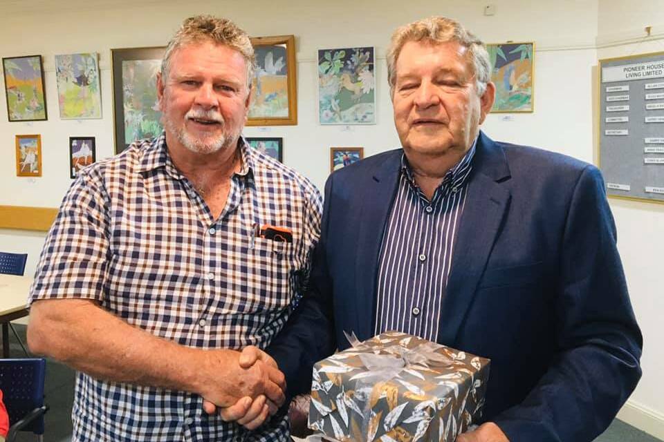 Chairman Alan Codrington thanks Bruce McGregor for his 30 years of service on the Pioneer House Board.