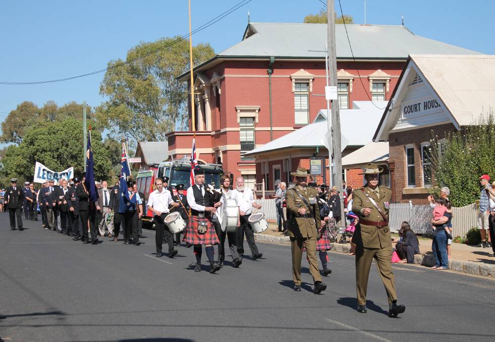 Lt Col James R Sinclair RFD, special guest at the Gulgong Commemoration, leads the march.