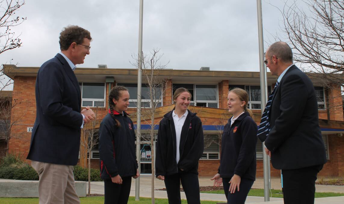 Mudgee High School students Ella Murnane, Kasey Hayes, and Charlotte Roberts, pictured with Andrew Gee MP and MHS principal Wayne Eade.