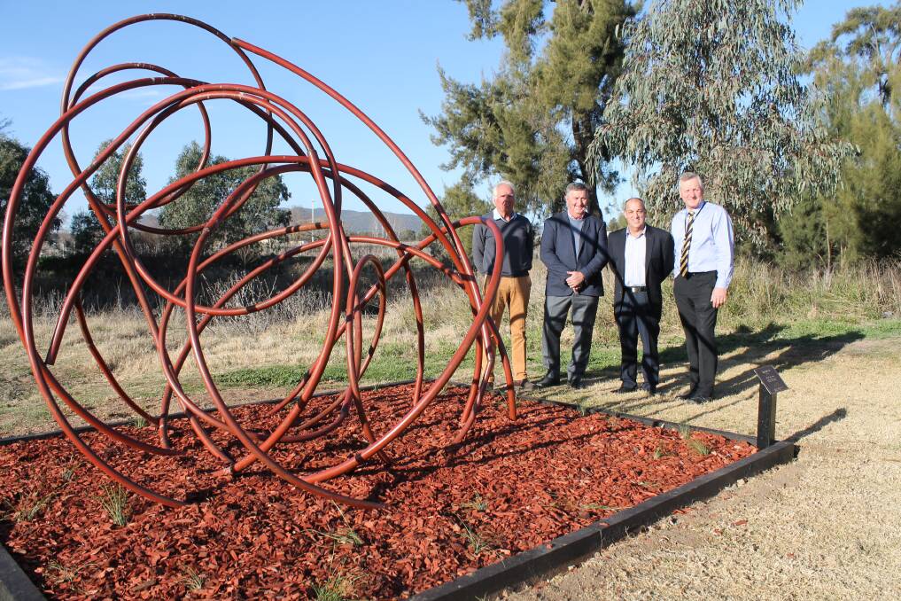 'Turbulent' by Tobias Bennett, is one of the latest additions to the Lawson Park Sculpture Walk, pictured with Gerald Norton-Knight (SIG, Rosby), mayor Des Kennedy, Steve Archinal (Moolarben), and MWRC general manager Brad Cam.