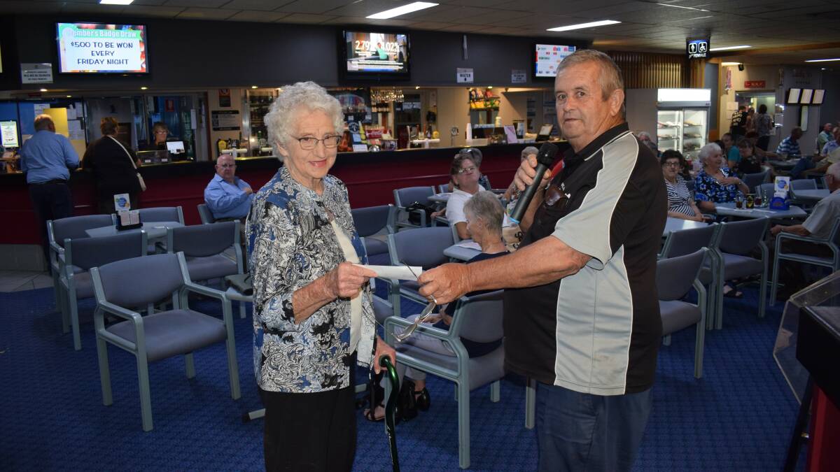 John Mobbs, president of the Gulgong Bowling and Sporting Club, presenting Mrs Haley, president of the Gulgong Branch of the Red Cross, with a cheque for $4813, photo SUPPLIED.