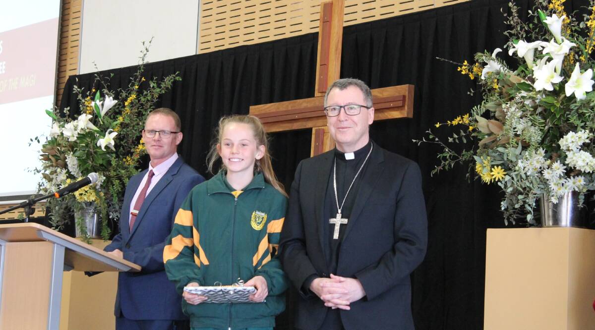 St Matthew's hosted the diocesan launch of Mission Month, pictured is principal Jason Hanrahan and Bishop Michael McKenna, with one of the Art Award winners Alesha Bennetts.