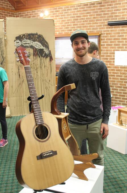 Ryan Tyrrell made this acoustic guitar and stand.
