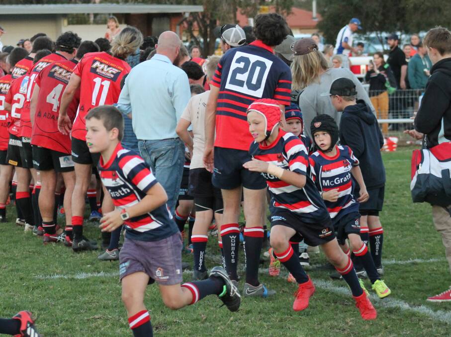 It may have been Old Boys Day, but the club's young players also had the star treatment when they ran through the tunnel of seniors onto the field.