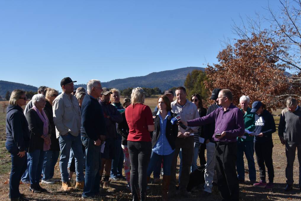 Locals gathering for a press conference on Friday at the Rusten's property, next door to the proposed solar farm site.