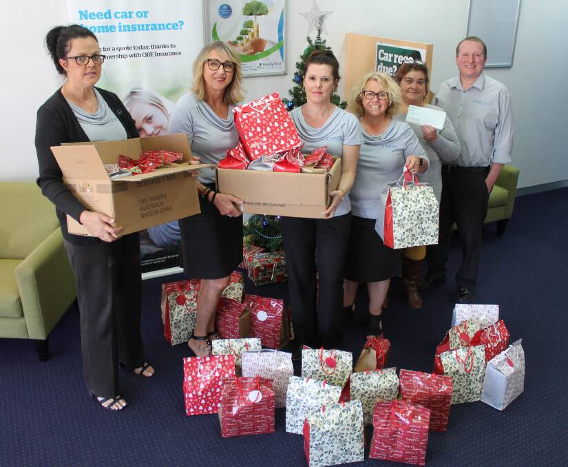 Mudgee Family First Credit Union donated $1,000 to Kinship at Christmas and is the collection point for the gift packs, (from left) Nicholle Reston, Mary Pitt, Jenna Blewitt, Debbie Degoumois, Roxanne Wilshire, and James McKidd.