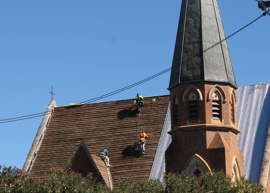 ROOF REPLACEMENT: Work on replacing the roof at the Mudgee Presbyterian Church last week, it's expected to be ready in about a month.