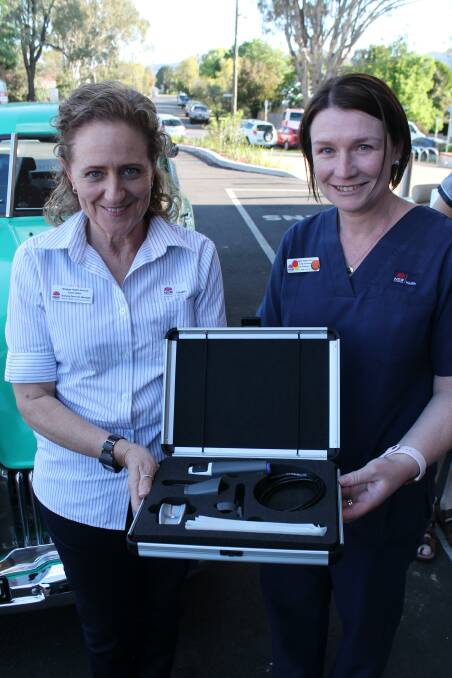 Mudgee Health Service's Karen Walsh and Kylie Forrester with the new General Examination Imaging System camera.