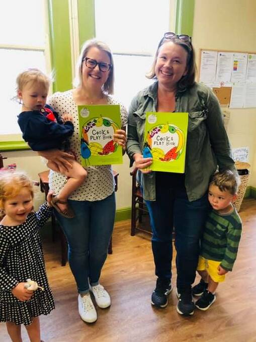 Sarah Baume and Kim Gribble of the Mudgee Community Preschool Social Club with copies of the book, which is a fundraising initiative for the organistion, photo supplied.