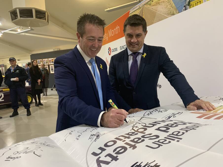 SIGNING THE ROAD SAFETY PLEDGE: Bathurst MP Paul Toole and Australian Road Safety Foundation founder and CEO Russell White.