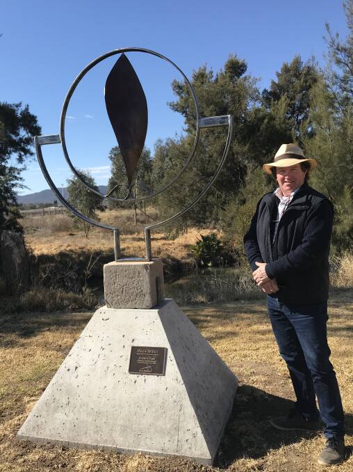 Mudgee's Richard Nagel with his piece 'Flame Within', inspired by the resilience of farmers during the current drought.