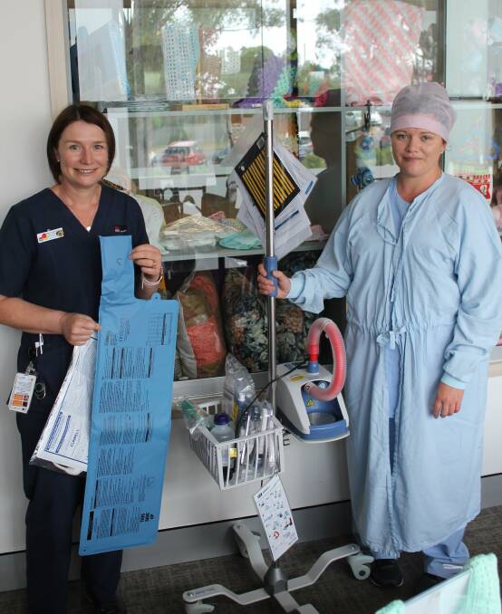 Kylie Forrester with a out-of-bed sensor for Tilecote, and Kristy Martin with the Optiflow THRIVE for Theatre, items purchased by the Auxiliary.