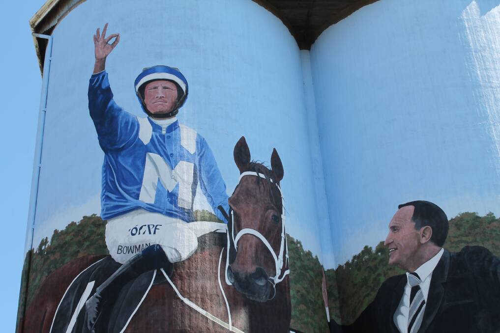 Peter Morimore's painting of Dunedoo jockey Hugh Bowman, champion mare Winx and her trainer Chris Waller, on the eastern side of the silos, the town and western sides will be rural scenes containing crops and black swans.
