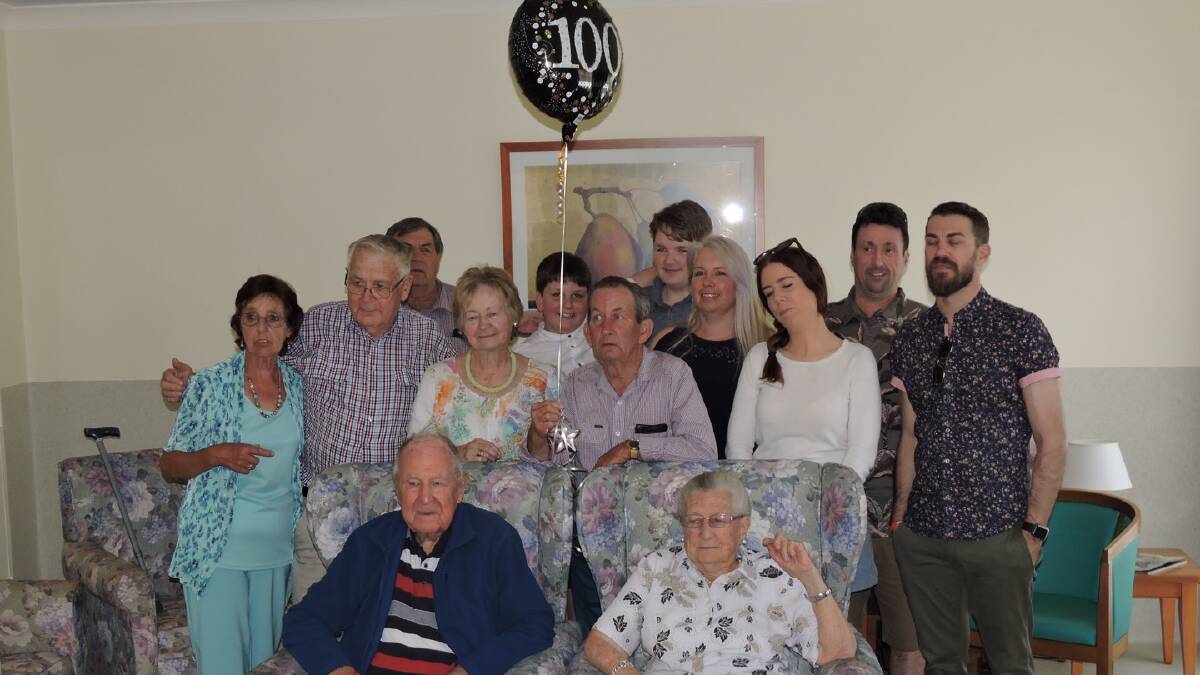 Pat Woods celebrates his 100th birthday with family.