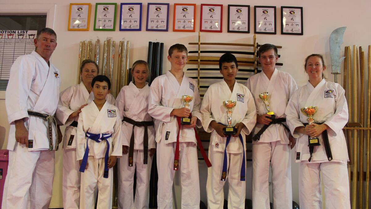 BRINGING IT HOME: Mudgee Martial Arts had eight students (seven pictured, with Geoff Spice) compete at the State Titles. 