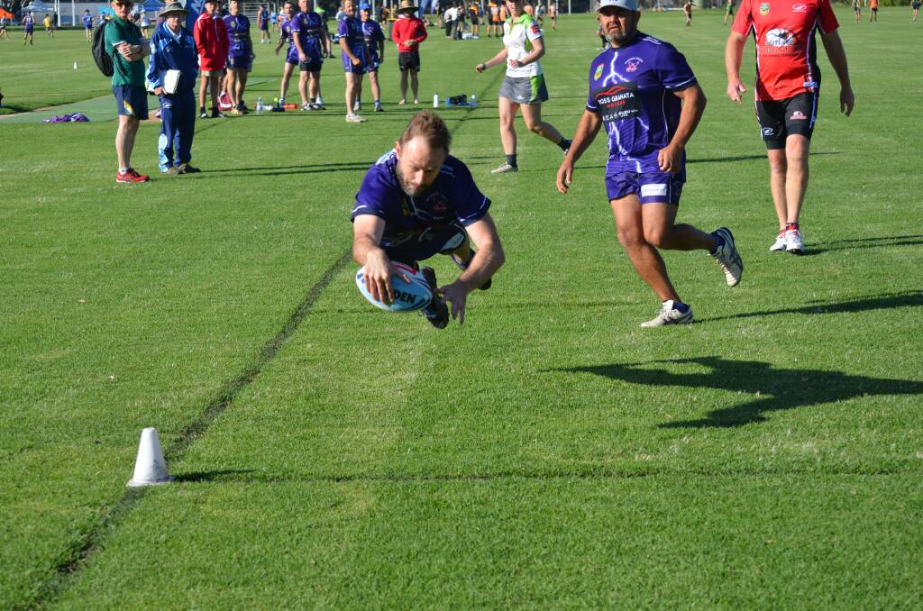 SUPER DIVE: Mudgee men’s 40s player Dease Henwood goes for a touchdown at the Country Championships in Dubbo on the weekend.