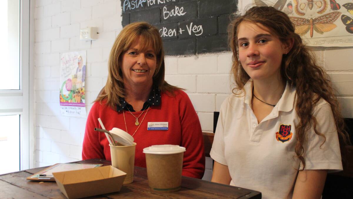 Stephanie Phyllis and coach Alison Whittaker, pictured at b.Ash Cafe with some of the biodegradable items that form the basis of her community service project.
