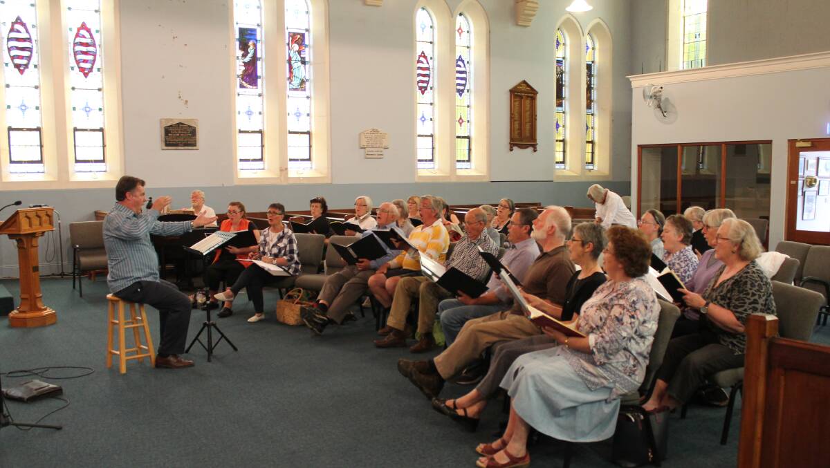 TUNE UP:  William Moxey and members of the Cudgegong Choir conduct a workshop at the Uniting Church ahead of Handel’s Messiah at the Gulgong Prince Of Wales Opera House.