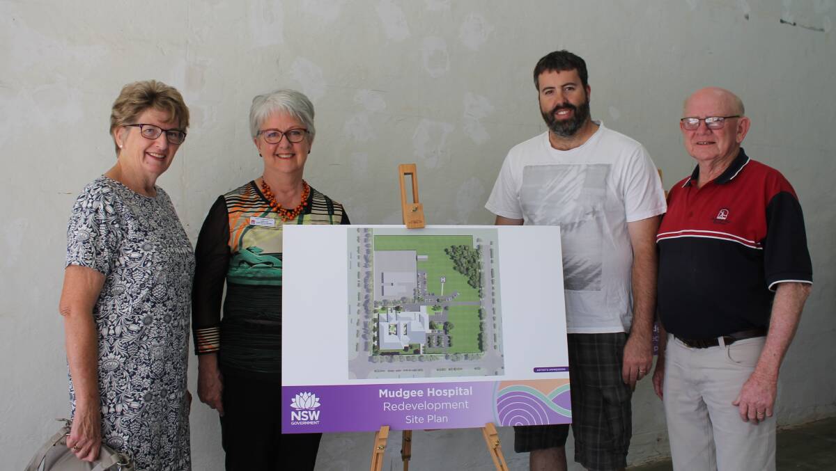 Judy Blackman (local health council), Judith Ford (local health services manager), Joel Wilson, and Joe Sullivan check out the plans.