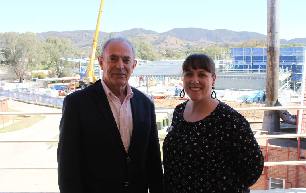 New Health Service manager for Mudgee and Gulgong Caren Harrison and Health Council chair John Bentley, overlooking construction of the new Hospital.