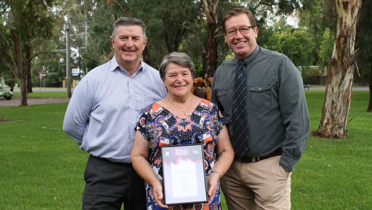 RECOGNITION: Local volunteer Pat Burns is presented with the Dubbo Electorate 'Woman of the Year' award by mayor Des Kennedy and MP Troy Grant.