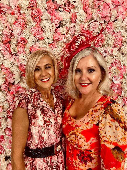 FROCKED UP: Christine Morgan and Tracey Bevan at the Pink Up Races on Saturday.
