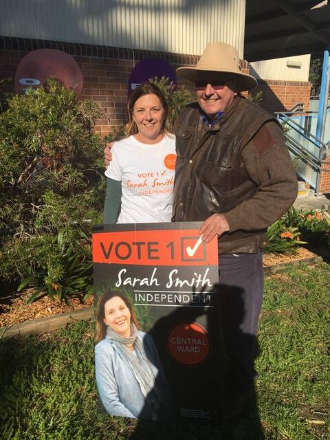Sarah Smith, originally from Mudgee, with father James Pirie at the Anna Bay Public School polling booth on Saturday.