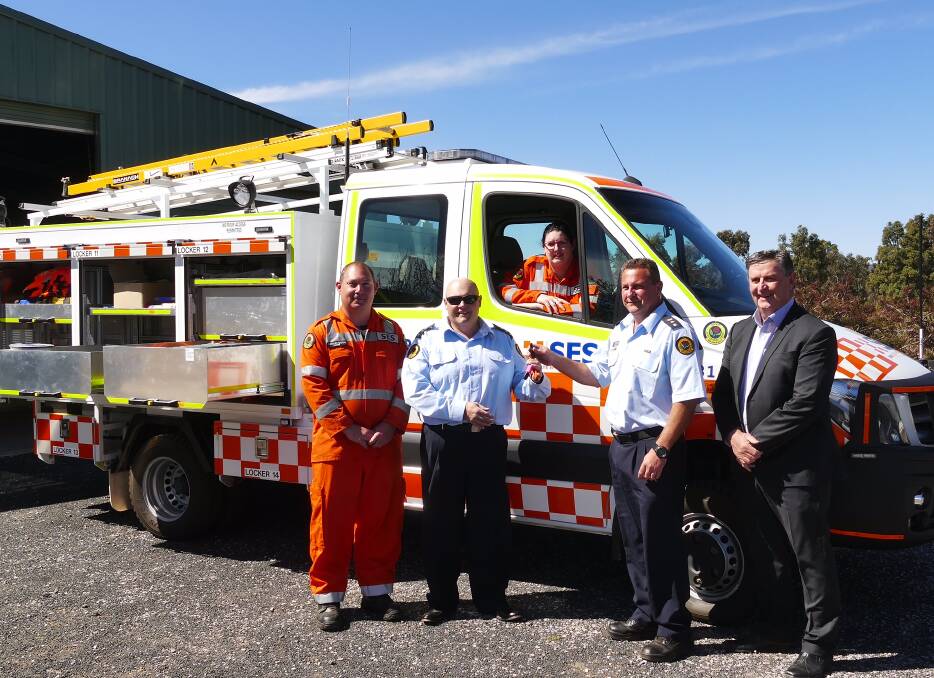 KEY MOMENT: Mudgee deputy controller Jason Thurlow receives the vehicle's keys from region controller David Monk, pictured with local volunteers Andrew Mottershead and Teagan Southwell and mayor Des Kennedy.