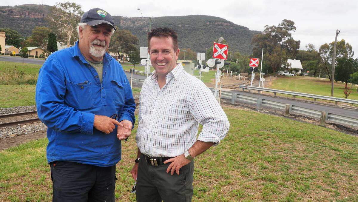 Bathurst MP Paul Toole with Buzz Sanderson at the rail crossing in
Kandos as work forges ahead on the $1.1 million Kandos-Rylstone heritage rail link. 
