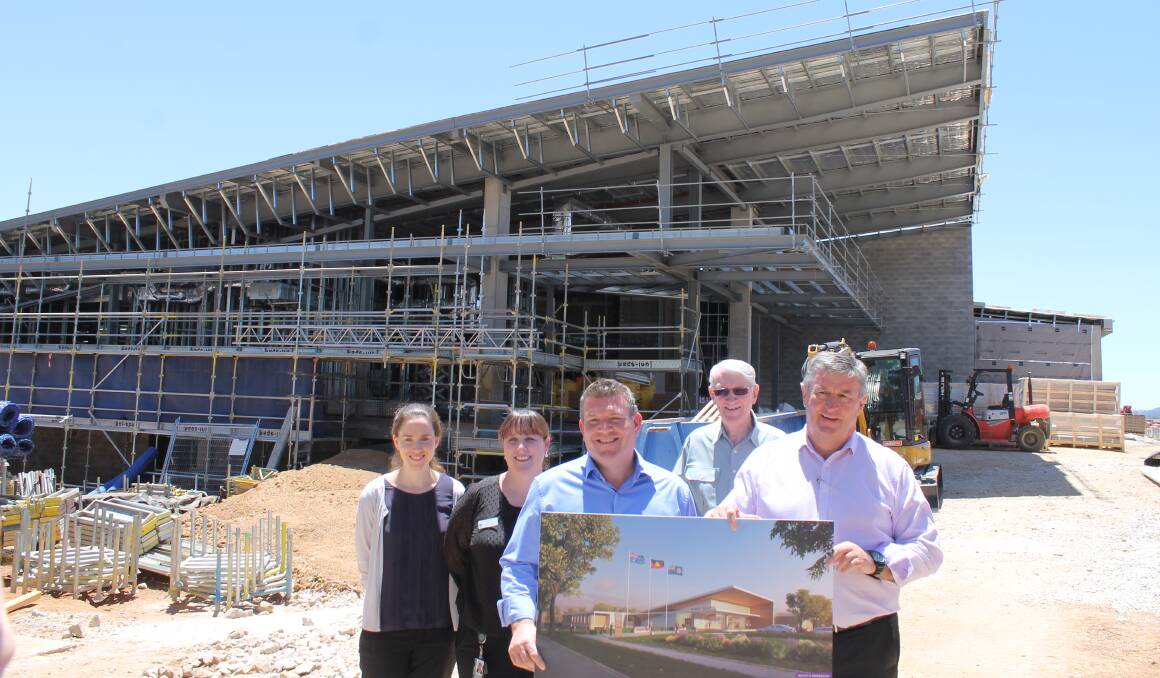 FROM PLAN TO PROGRESS: The design for the new hospital entrance at the site, with project manager Katie Babula, Health Services manager Caren Harrison, Dugald Saunders MP, Peter Wormald (Mudgee Health Council), and Mayor Des Kennedy, in late November 2019.