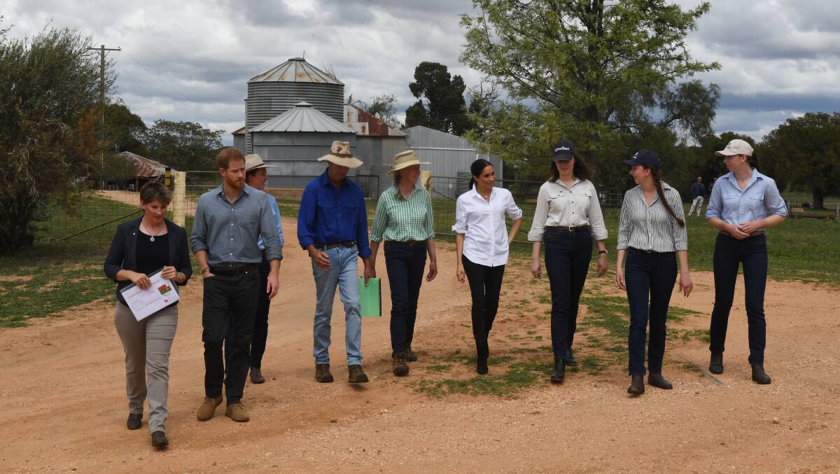 ROYAL WALKABOUT: The Duke and Duchess of Sussex were taken on a tour of the Woodley's family farm, east of Dubbo.