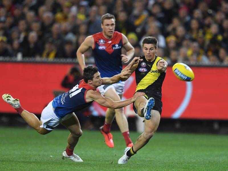 Liam Baker's Richmond (R) proved far too strong for Melbourne, winning by 43 points.