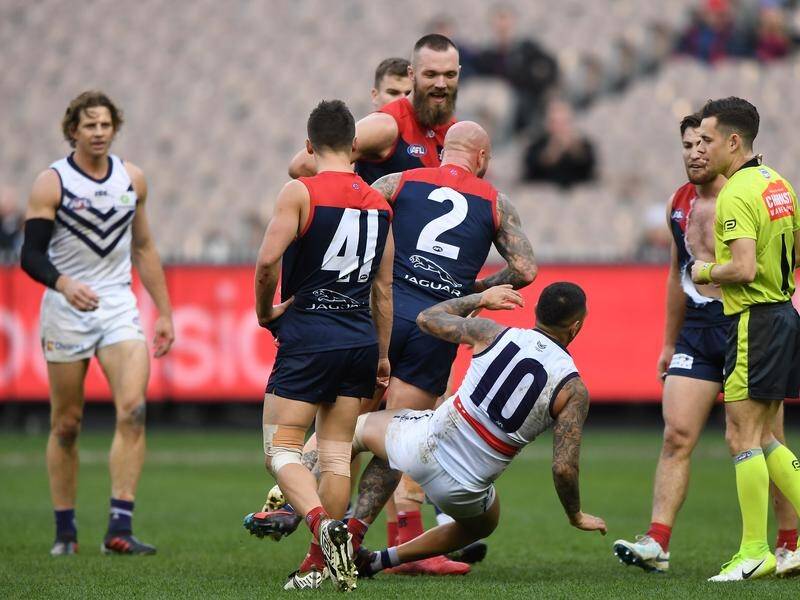 Teammates have told off Nathan Jones (No.2) over a bump in Melbourne's AFL win over Fremantle.