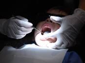A report calls on the government, states and territories to achieve universal access to dental care. (Mick Tsikas/AAP PHOTOS)