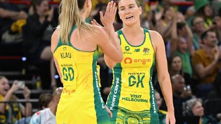 Lightning recruit Courtney Bruce (right) returns to Perth for her first match against her old team. (Darren England/AAP PHOTOS)