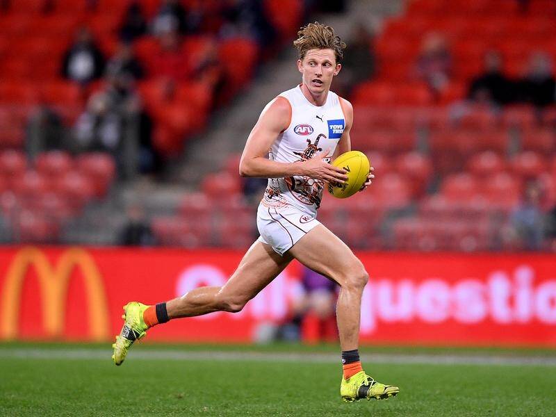 Dashing midfielder Lachie Whitfield will return to the GWS line-up for their clash with Essendon.