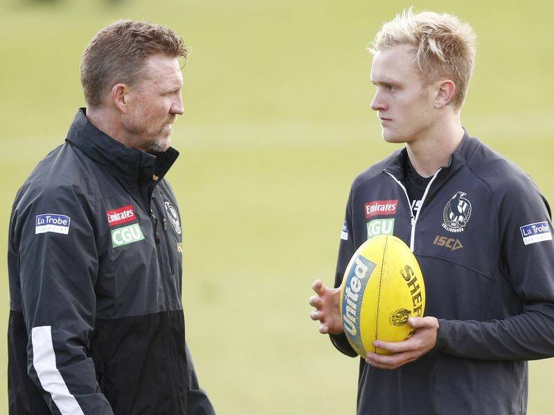 Magpies head coach Nathan Buckley (left) will be without Jaidyn Stephenson for the next 10 games.