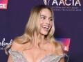 Margot Robbie has been recognized as a trailblazer as she and her film Barbie won a swag of awards. (Darren England/AAP PHOTOS)